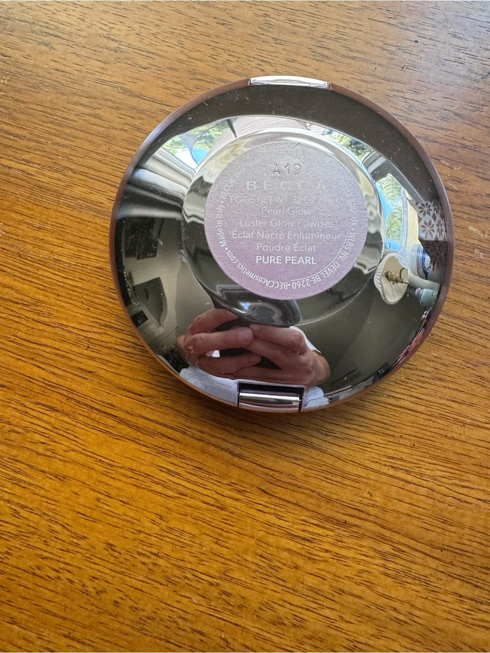 BECCA Shimmering Champagne Highlighter Compact in Pure Pearl